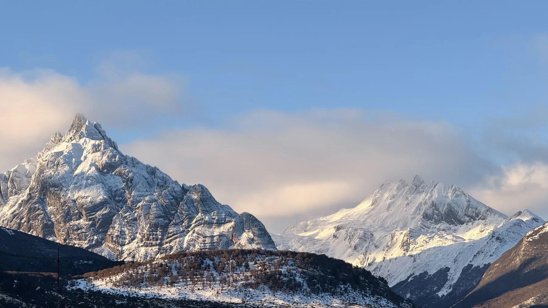 Snow-covered peaks in daylight